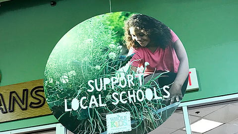 Whole Foods 'Support Local Schools' Ceiling Sign