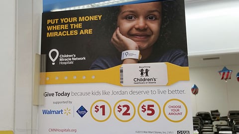 Walmart 'Miracles' Checkout Sign
