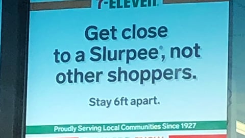 7-Eleven 'Get Close to a Slurpee, Not Other Shoppers' Window Sign