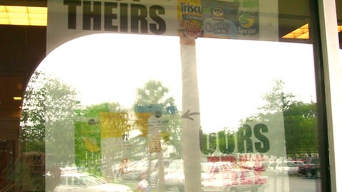 Publix 'Buy Theirs, Get Ours Free' Window Sign