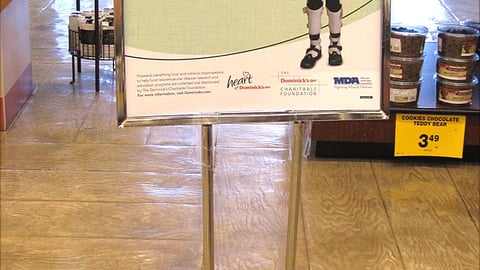Dominick's 'Make a Muscle' Stanchion Sign
