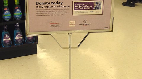 Dominick's 'Help People' Stanchion Sign