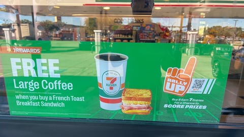 7-Eleven 'Free Large Coffee' Window Sign